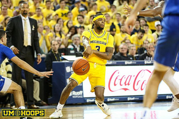 Juwan Howard and Zavier Simpson (3)