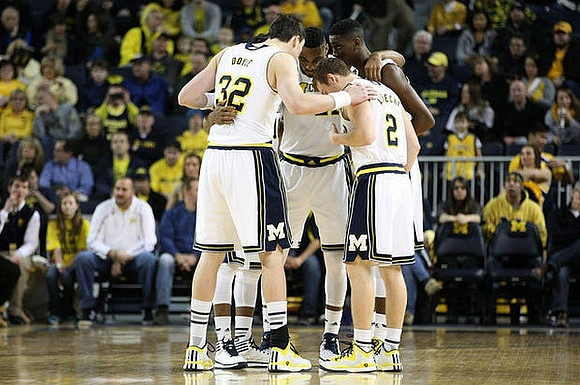 Ricky Doyle (32), Zak Irvin (21), Spike Albrecht (2), and Caris LeVert (23)