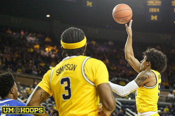 Zavier Simpson (3) and Eli Brooks (55)
