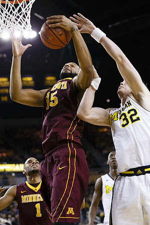 Caris LeVert (23) and Ricky Doyle (32)