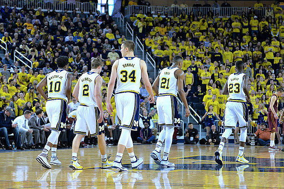 Derrick Walton Jr. (10), Spike Albrecht (2), Mark Donnal (34), Zak Irvin (21), and Caris LeVert (23)