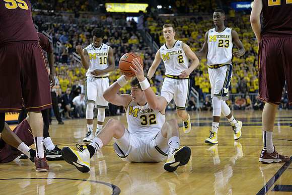 Derrick Walton Jr. (10), Ricky Doyle (32), Spike Albrecht (2), and Caris LeVert (23)
