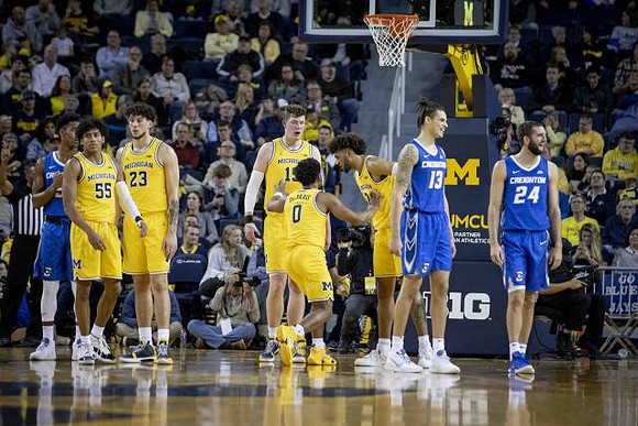 Eli Brooks (55), Brandon Johns Jr. (23), Jon Teske (15), David DeJulius (0), and Isaiah Livers (2)