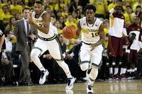 Minnesota Head Coach Richard Pitino, Zak Irvin (21), and Derrick Walton Jr. (10)