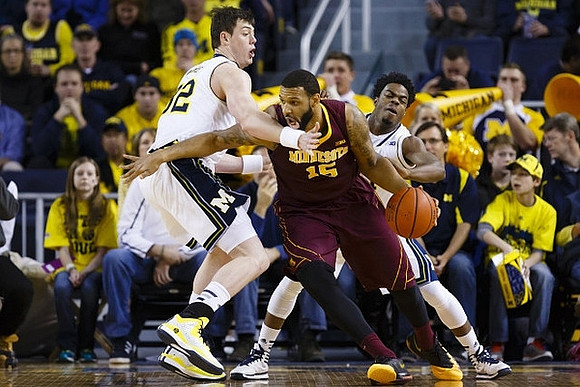 Ricky Doyle (32) and Derrick Walton Jr. (10)
