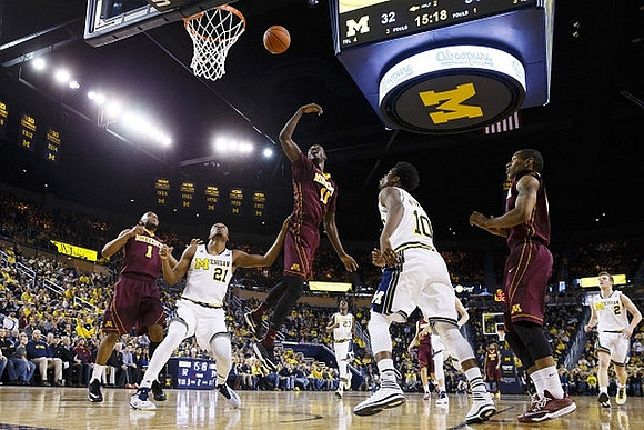 Zak Irvin (21), Caris LeVert (23), Derrick Walton Jr. (10), and Spike Albrecht (2)