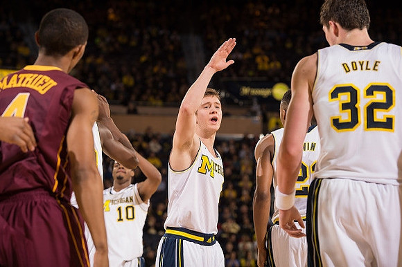 Derrick Walton Jr. (10), Spike Albrecht (2), Zak Irvin (21), and Ricky Doyle (32)