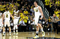Spike Albrecht (2), Caris LeVert (23), and Ricky Doyle (32)