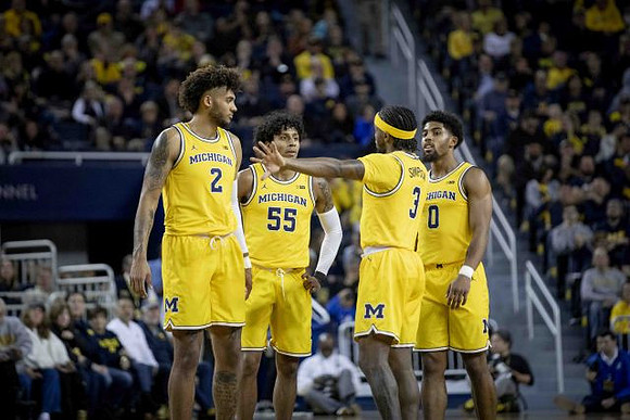 Isaiah Livers (2), Eli Brooks (55), Zavier Simpson (3), and David DeJulius (0)