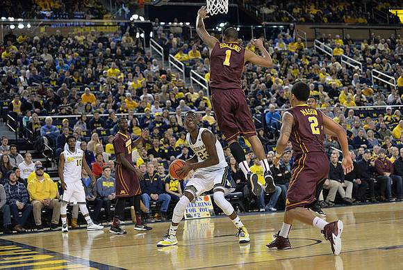 Derrick Walton Jr. (10) and Caris LeVert (23)