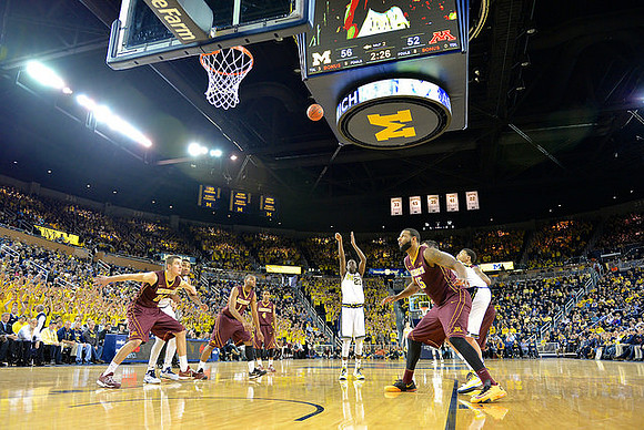 Zak Irvin (21) and Caris LeVert (23)