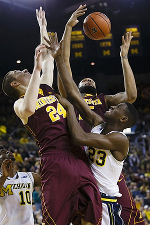 Derrick Walton Jr. (10) and Caris LeVert (23)