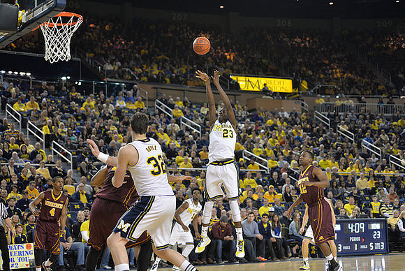 Ricky Doyle (32), Caris LeVert (23), and Derrick Walton Jr. (10)