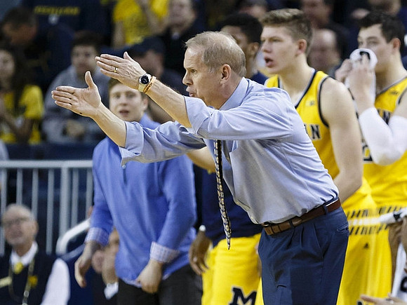John Beilein, Spike Albrecht (2), Moritz Wagner (13), and Ricky Doyle (32)