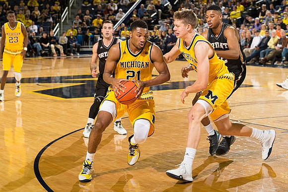 Caris LeVert (23), Zak Irvin (21), and Duncan Robinson (22)
