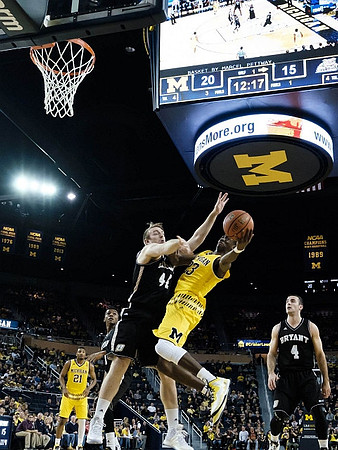 Zak Irvin (21) and Caris LeVert (23)