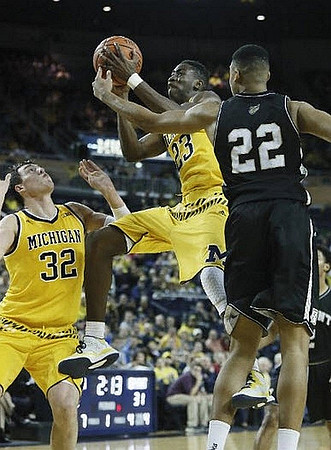 Ricky Doyle (32) and Caris LeVert (23)