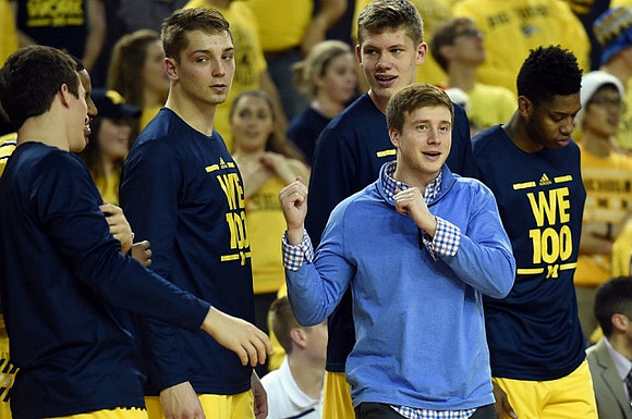 Andrew Dakich (11), Mark Donnal (34), Spike Albrecht (2), Moritz Wagner (13), and Kameron Chatman (3)