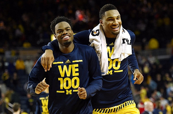 Derrick Walton Jr. (10) and Zak Irvin (21)
