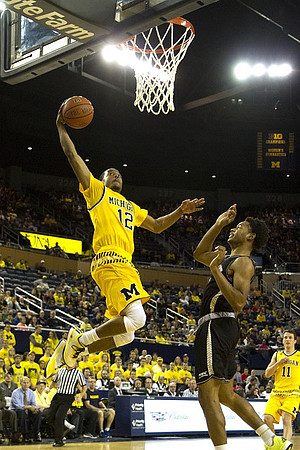Muhammad-Ali Abdur-Rahkman (12) and Andrew Dakich (11)