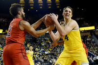 Mark Donnal (34) and D.J. Wilson (5)