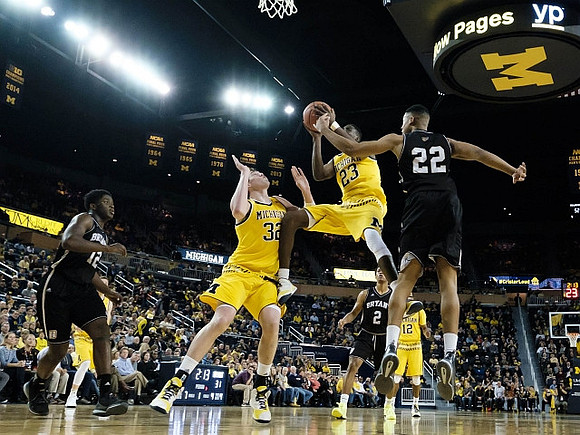 Ricky Doyle (32), Caris LeVert (23), and Muhammad-Ali Abdur-Rahkman (12)