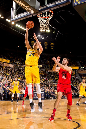 Muhammad-Ali Abdur-Rahkman (12), Mark Donnal (34), and Zak Irvin (21)