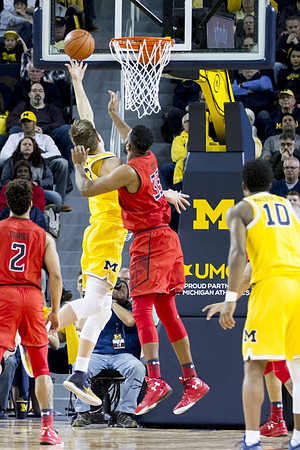 Moritz Wagner (13) and Derrick Walton Jr. (10)