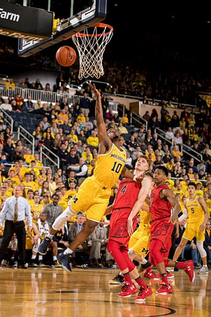 Derrick Walton Jr. (10) and D.J. Wilson (5)