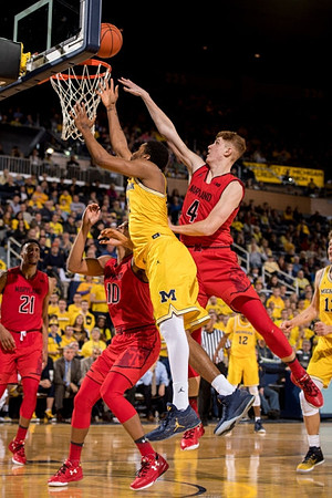 Zak Irvin (21), Muhammad-Ali Abdur-Rahkman (12), and Moritz Wagner (13)