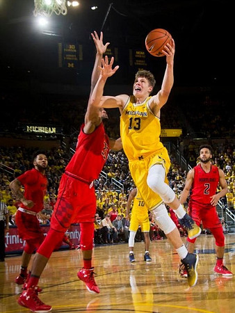 Moritz Wagner (13) and Derrick Walton Jr. (10)