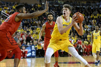 Moritz Wagner (13) and Derrick Walton Jr. (10)