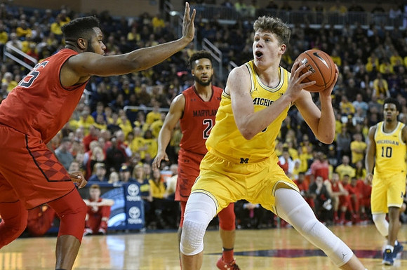 Moritz Wagner (13) and Derrick Walton Jr. (10)