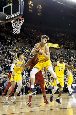 D.J. Wilson (5), Moritz Wagner (13), Derrick Walton Jr. (10), and Duncan Robinson (22)
