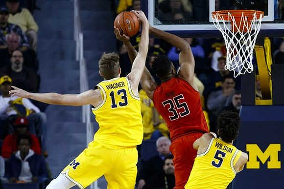 Moritz Wagner (13) and D.J. Wilson (5)