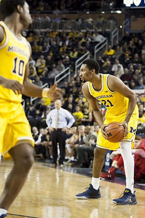 Derrick Walton Jr. (10) and Zak Irvin (21)