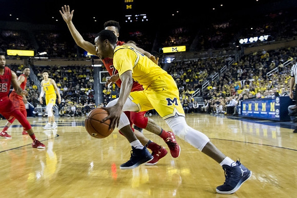 Muhammad-Ali Abdur-Rahkman (12) and D.J. Wilson (5)