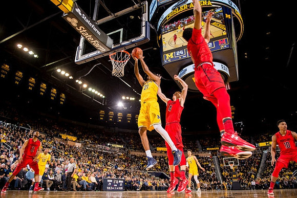 Muhammad-Ali Abdur-Rahkman (12), Zak Irvin (21), and D.J. Wilson (5)