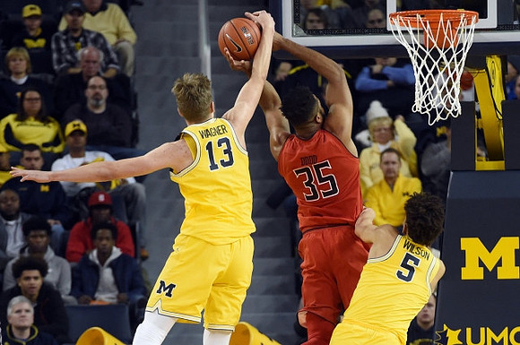 Moritz Wagner (13) and D.J. Wilson (5)