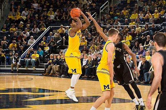 Derrick Walton Jr. (10) and Moritz Wagner (13)