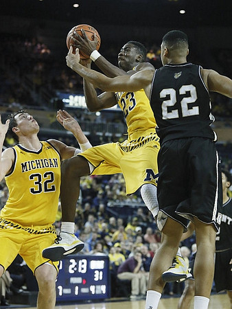 Ricky Doyle (32) and Caris LeVert (23)