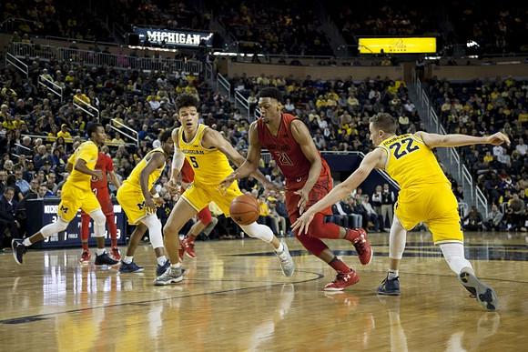 Muhammad-Ali Abdur-Rahkman (12), Derrick Walton Jr. (10), D.J. Wilson (5), and Duncan Robinson (22)