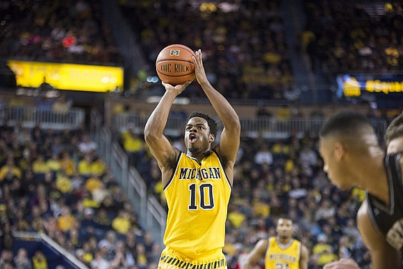 Derrick Walton Jr. (10) and Zak Irvin (21)