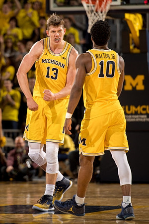 Moritz Wagner (13) and Derrick Walton Jr. (10)