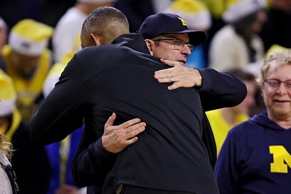 Jim Harbaugh and Juwan Howard