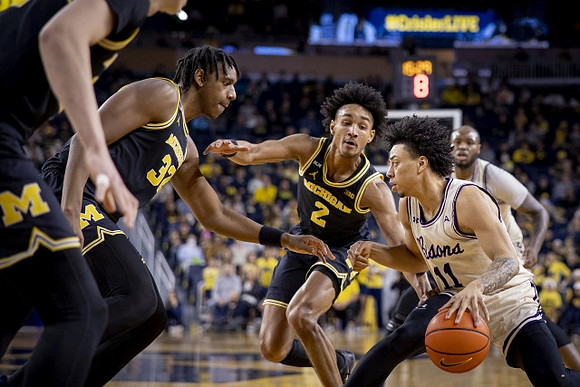 Tarris Reed Jr. (32) and Kobe Bufkin (2)