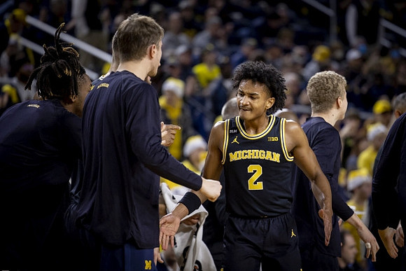 Kobe Bufkin (2) and Michigan Team