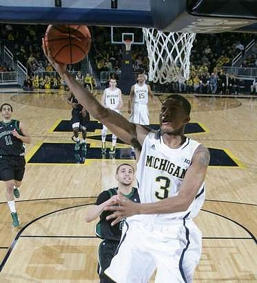 Caris LeVert (23) and Mitch McGary (4)