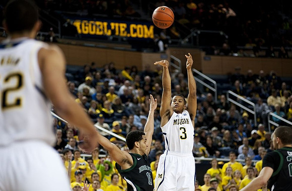 Trey Burke (3) and Jordan Morgan (52)