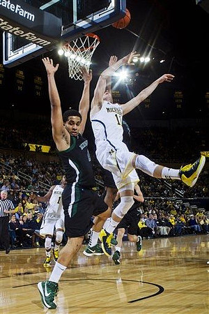 Glenn Robinson III (1) and Nik Stauskas (11)